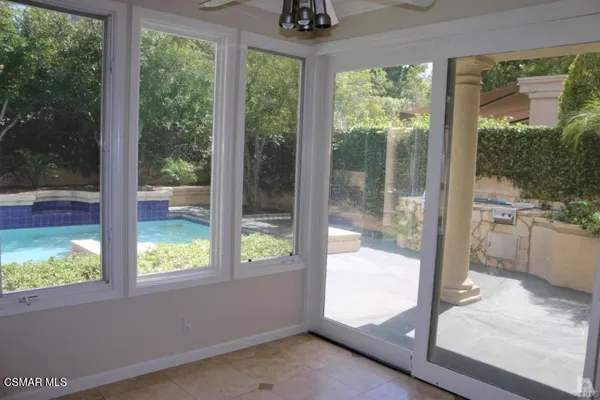 a view of a room with a large window