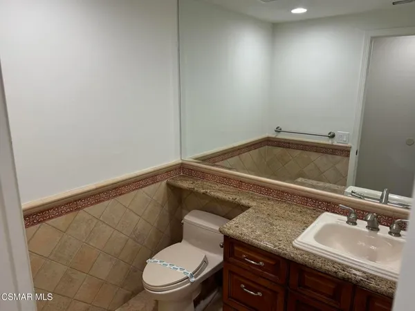 a living room with wooden floors and a fireplace