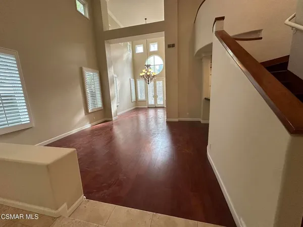 a view of an entryway with wooden floor