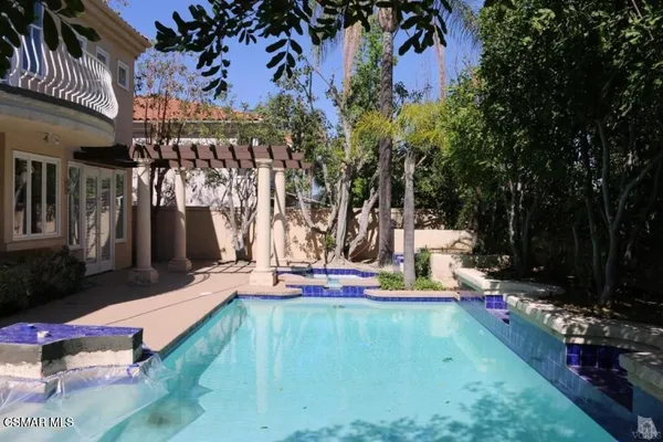 a view of yard with patio