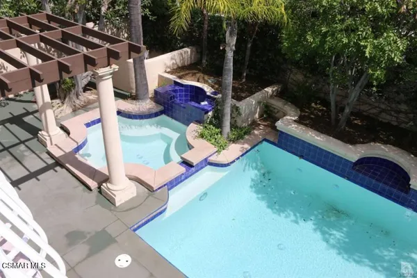 a view of a garden from a balcony