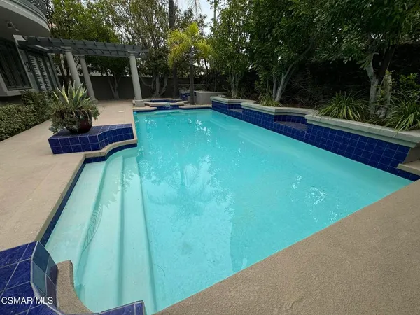 a view of a house with a swimming pool