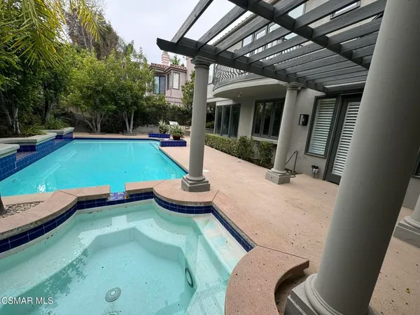 a view of a backyard with a sitting area