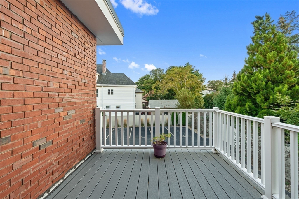 142 Pleasant Street, Unit 2 Winthrop, MA 02152 - Photo 13 of 14 a view of a balcony with wooden floor