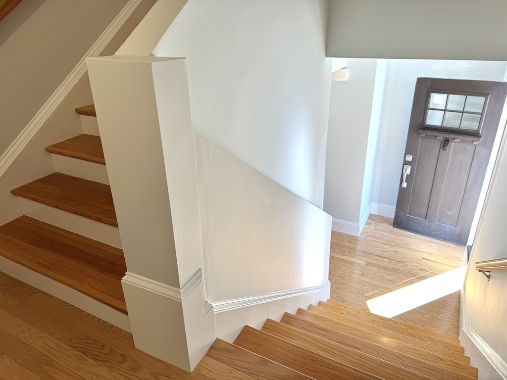 142 Pleasant Street, Unit 2 Winthrop, MA 02152 - Photo 8 of 14 a view of entryway and hall with wooden floor