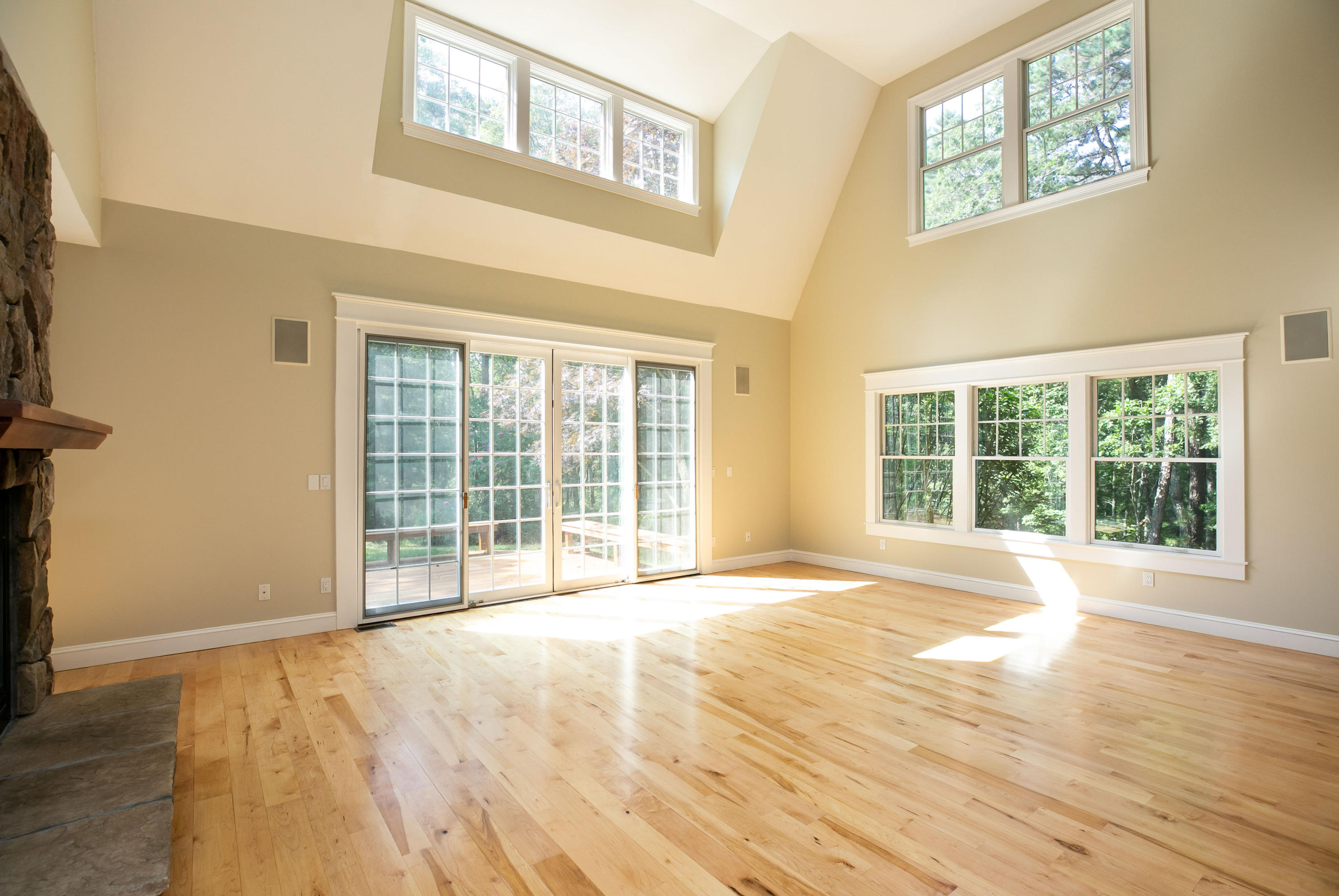 334 Waquoit Road Cotuit, MA 02635 - Photo 2 of 32 a view of an empty room with wooden floor and a window