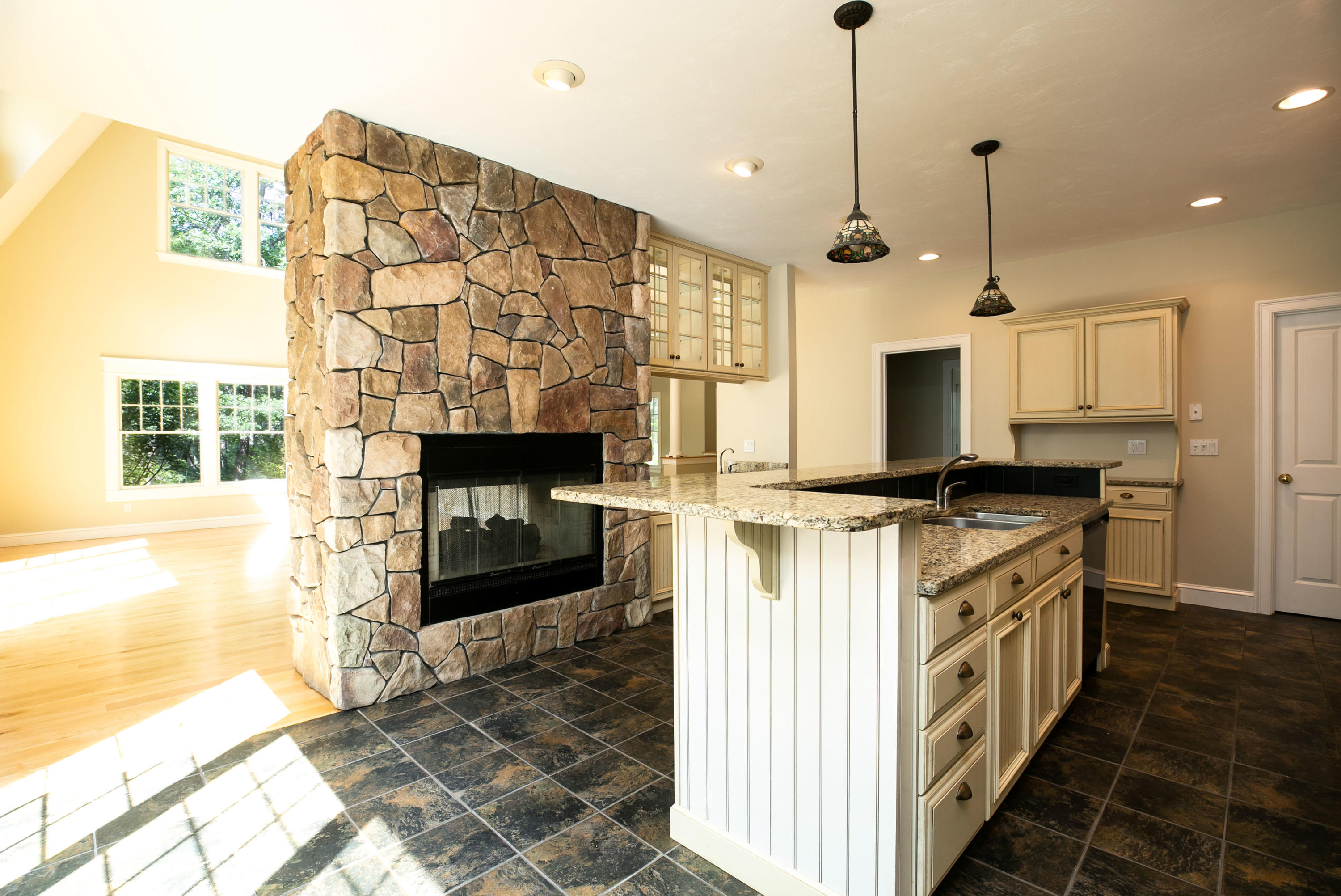 334 Waquoit Road Cotuit, MA 02635 - Photo 21 of 32 a kitchen with stainless steel appliances kitchen island granite countertop a stove a sink and a refrigerator