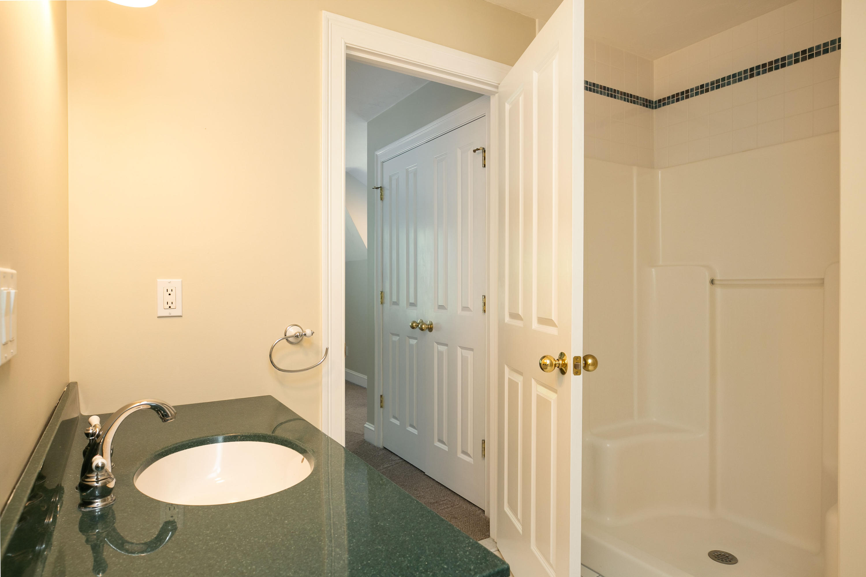 334 Waquoit Road Cotuit, MA 02635 - Photo 25 of 32 a bathroom with a sink a toilet and shower
