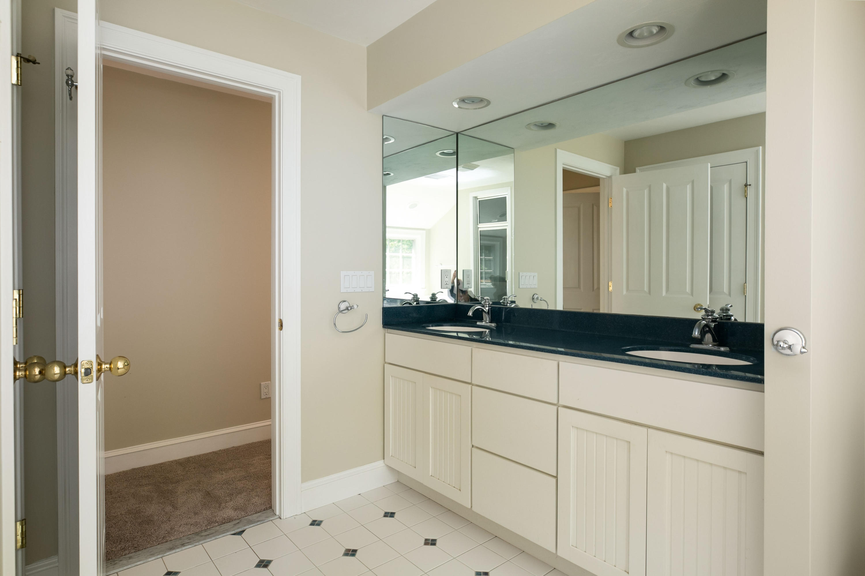 334 Waquoit Road Cotuit, MA 02635 - Photo 26 of 32 a bathroom with a sink and a mirror