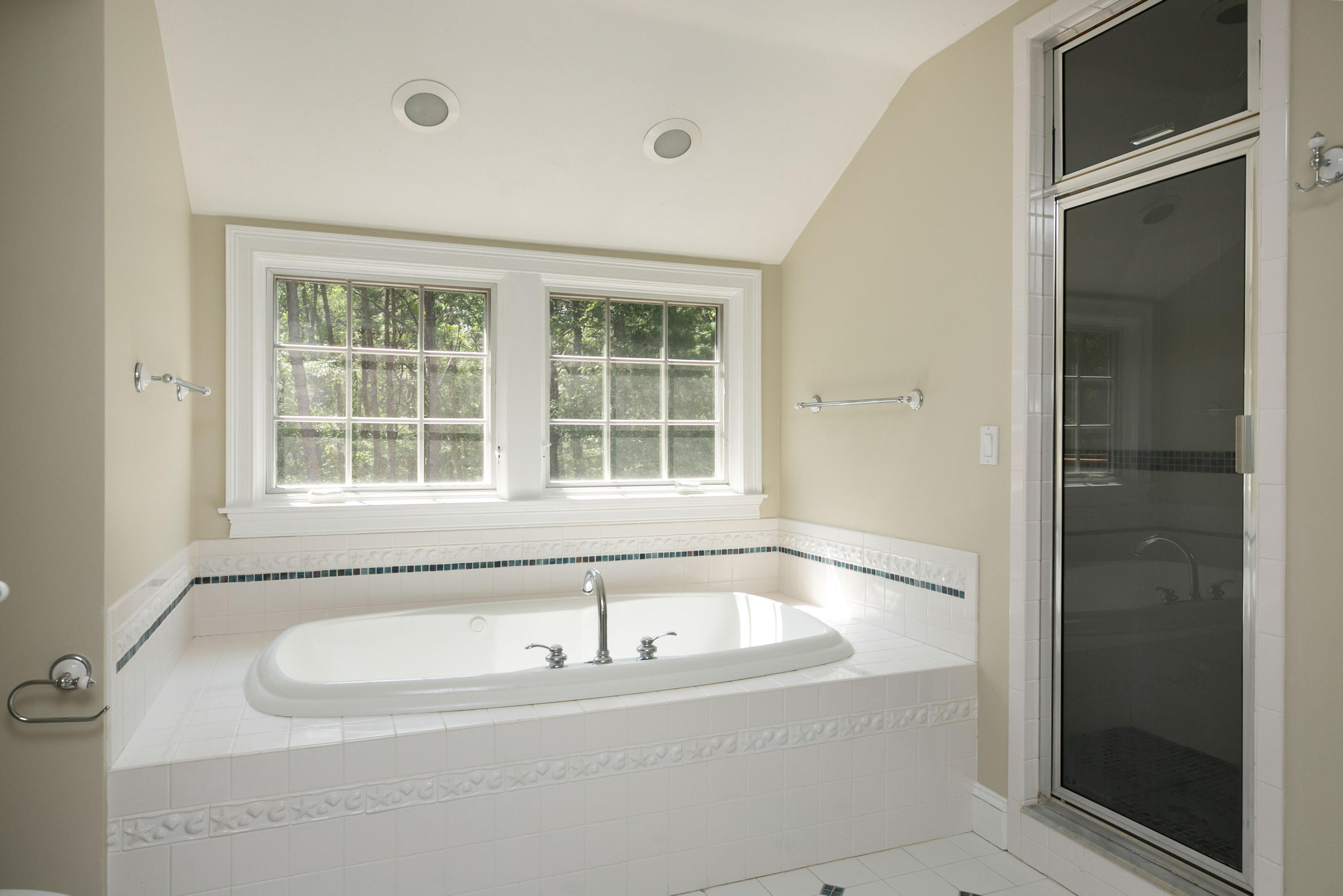 334 Waquoit Road Cotuit, MA 02635 - Photo 27 of 32 a bath tub sitting next to a window