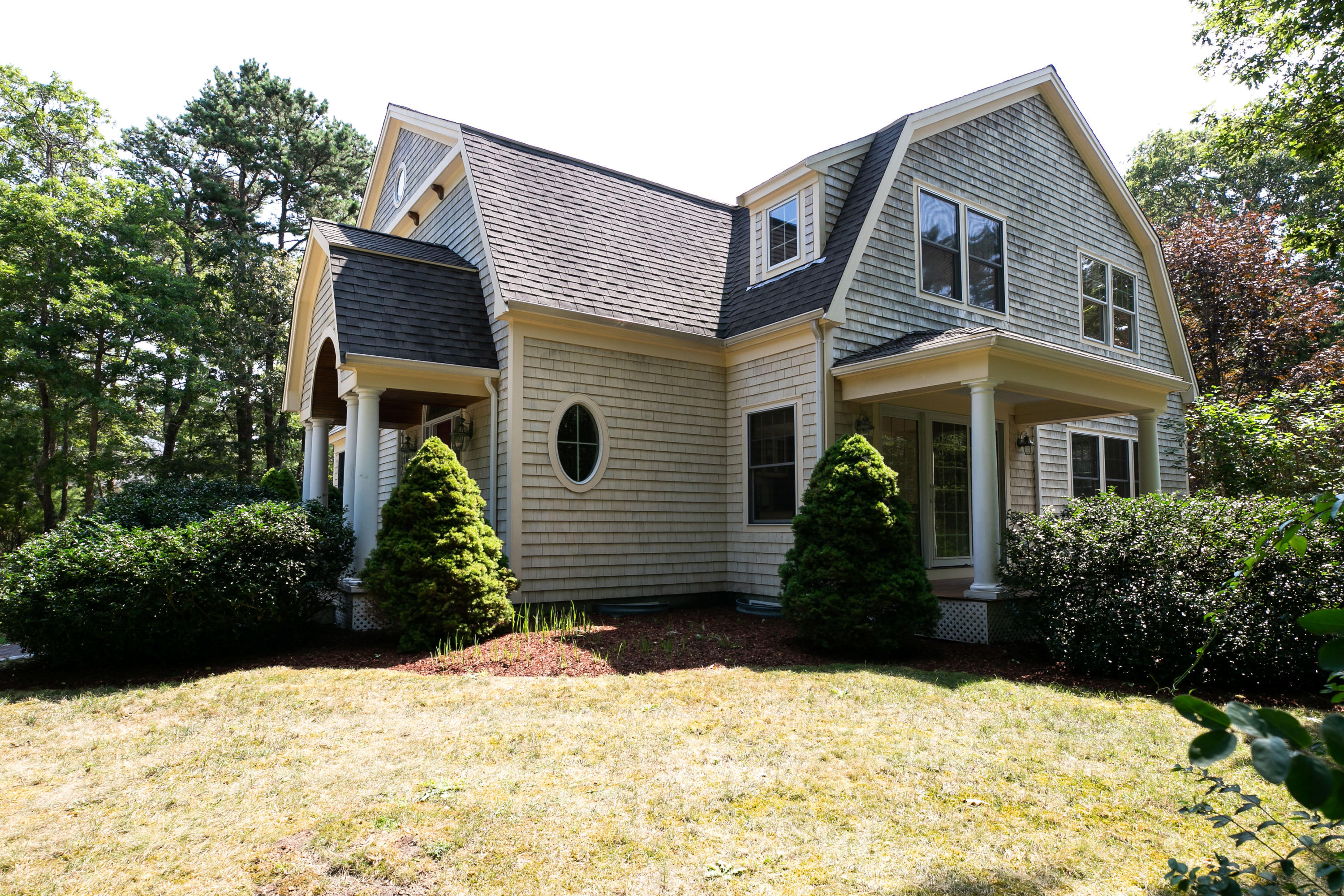 334 Waquoit Road Cotuit, MA 02635 - Photo 29 of 32 a front view of a house with a yard