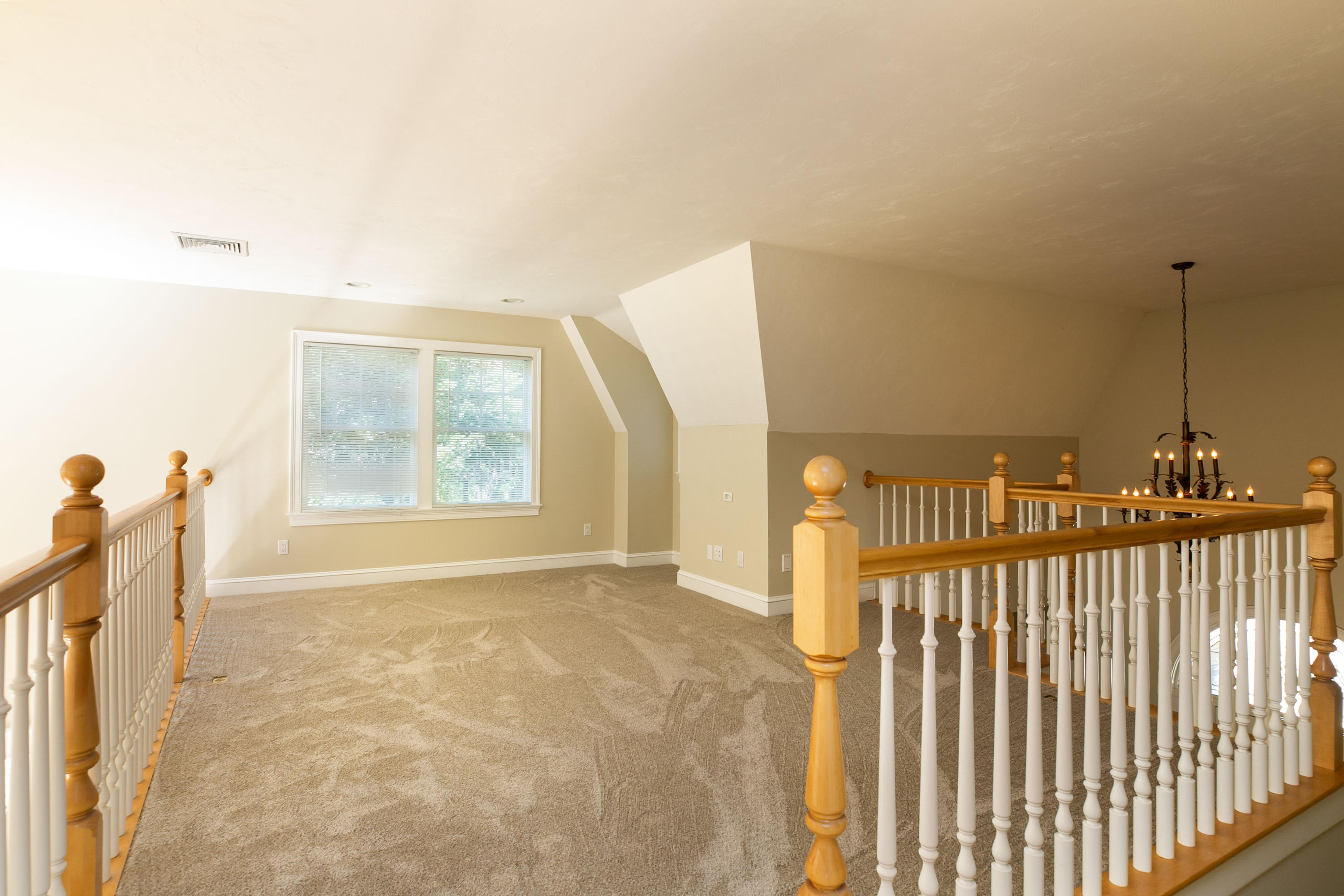 334 Waquoit Road Cotuit, MA 02635 - Photo 6 of 32 a view of a hallway view with wooden floor and a fireplace