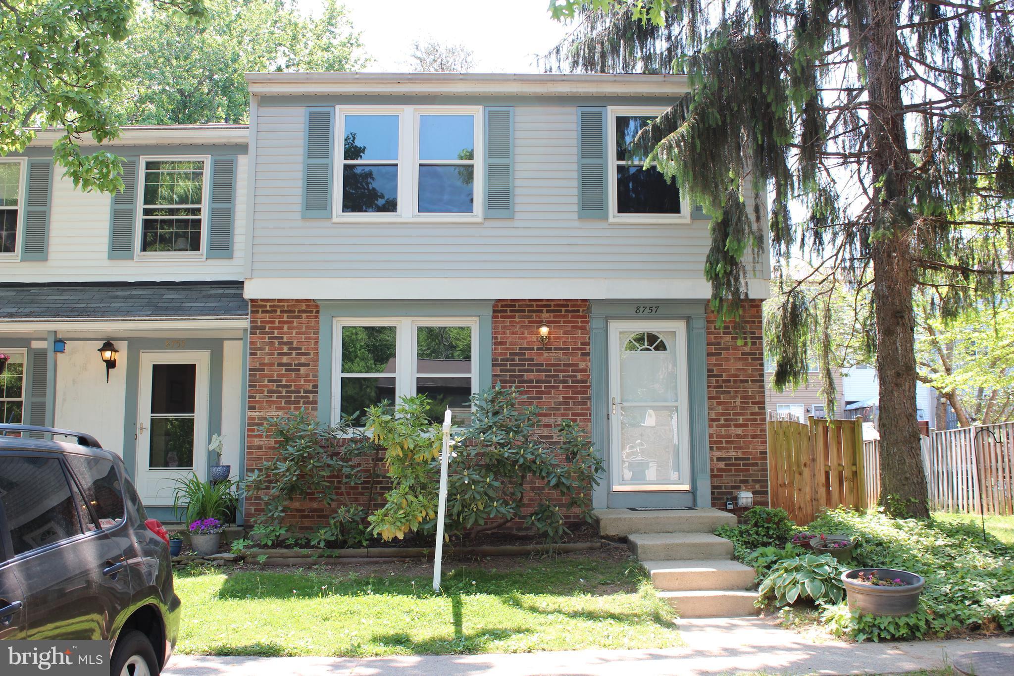 8757 Newington Commons Road Lorton, VA 22079 - Photo 1 of 20 front view of a house with a yard