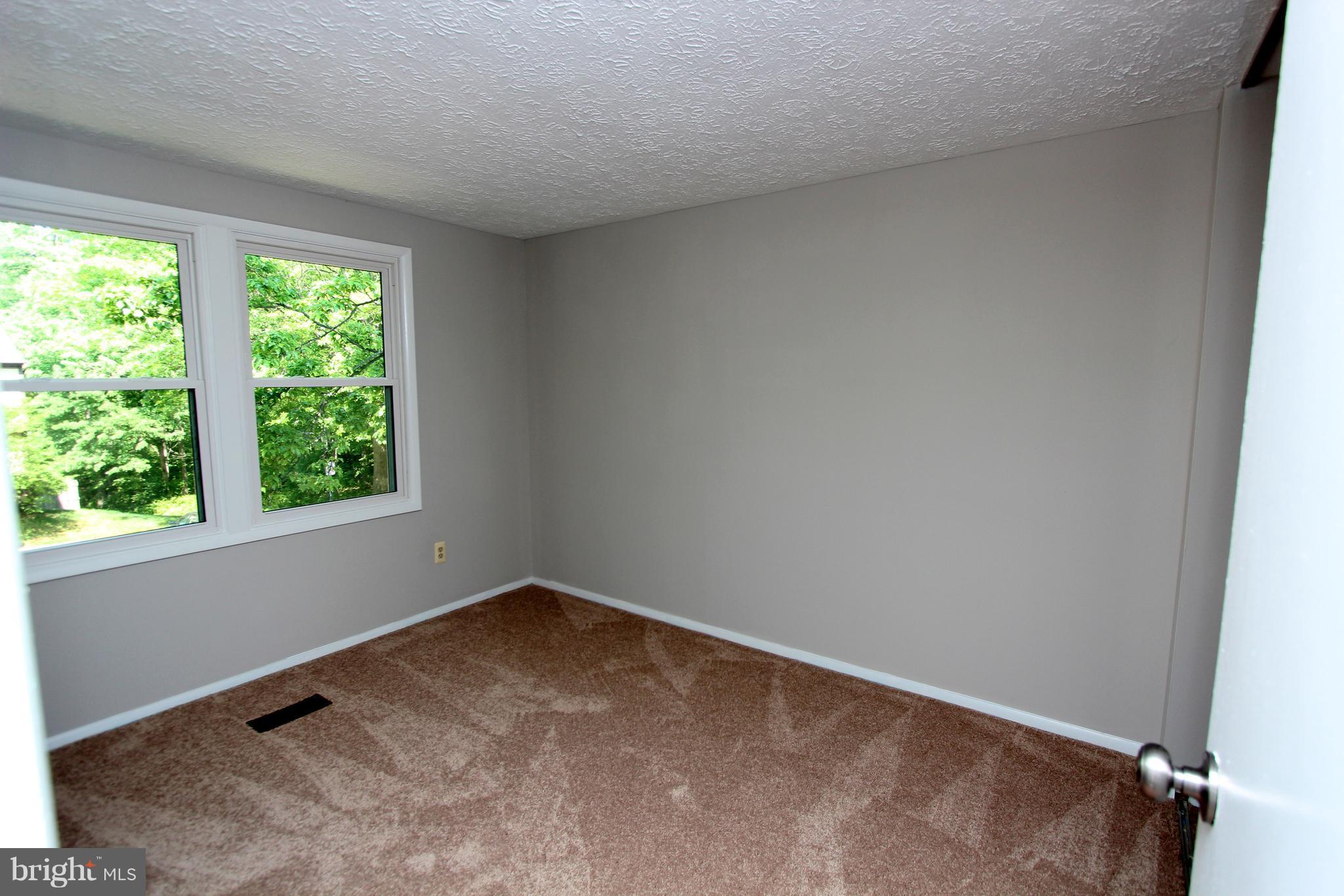8757 Newington Commons Road Lorton, VA 22079 - Photo 12 of 20 an empty room with a window