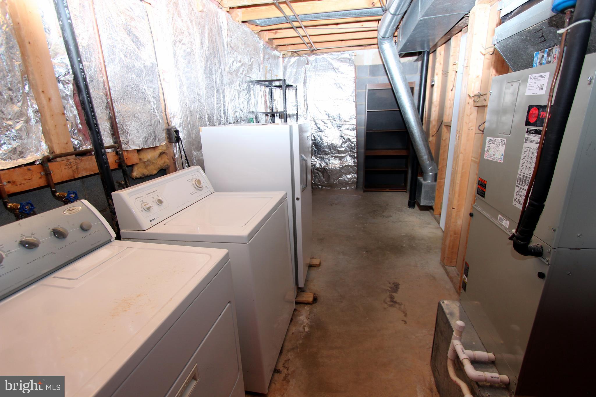 8757 Newington Commons Road Lorton, VA 22079 - Photo 18 of 20 a utility room with dryer and washer