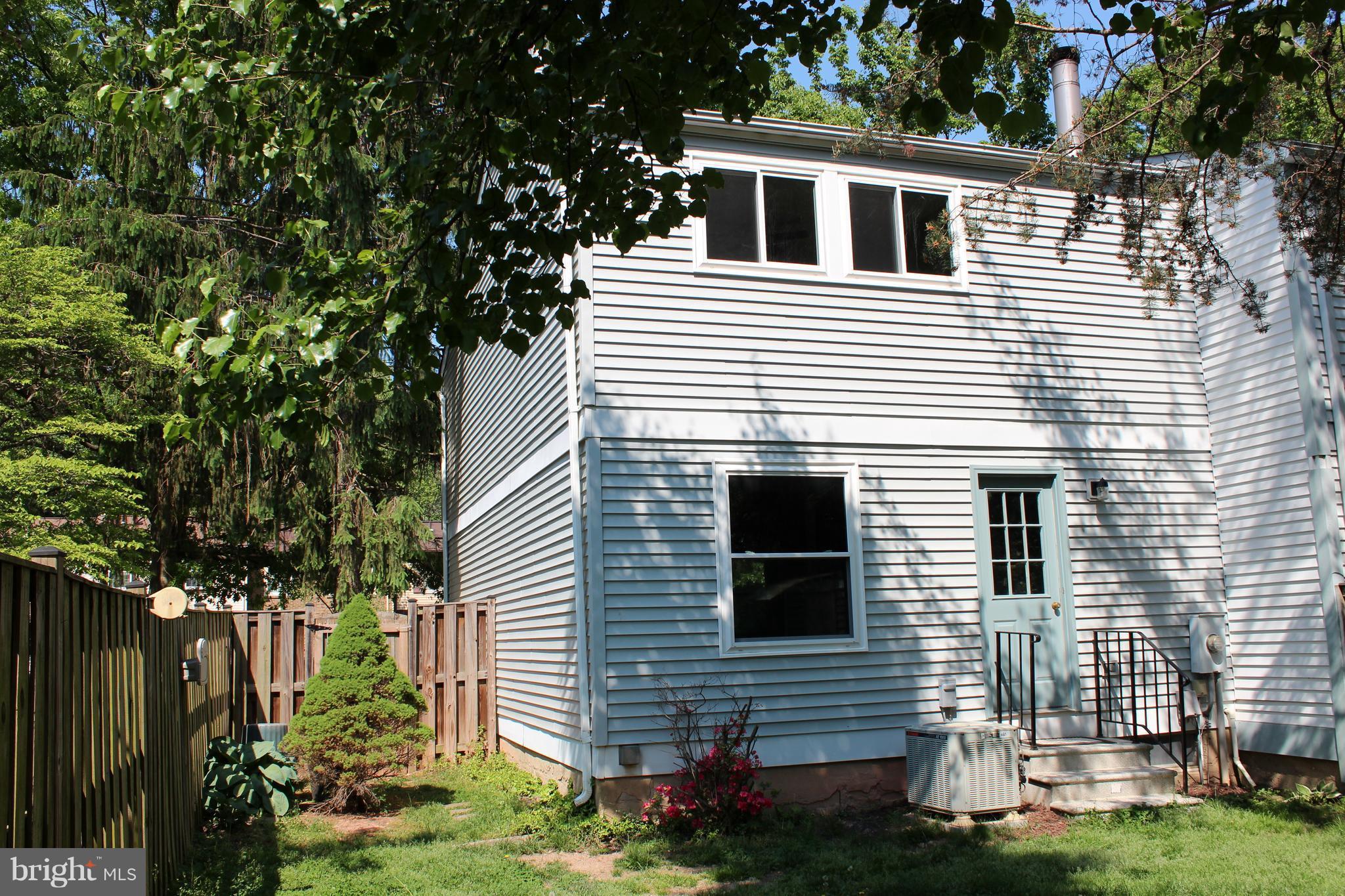 8757 Newington Commons Road Lorton, VA 22079 - Photo 19 of 20 a view of house that has a car park