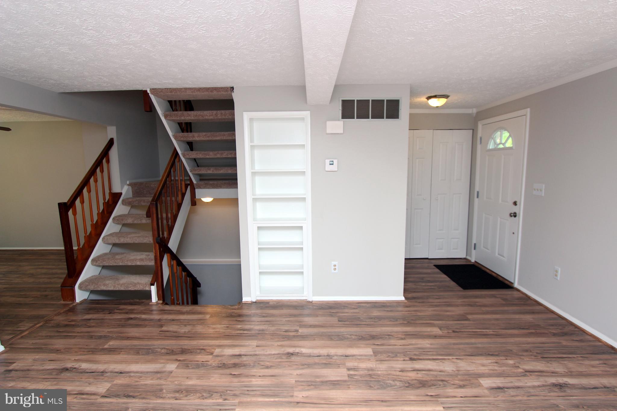 8757 Newington Commons Road Lorton, VA 22079 - Photo 5 of 20 a view of an entryway with wooden floor