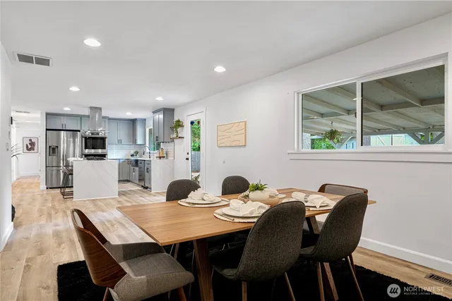 a view of a dining room with furniture and window