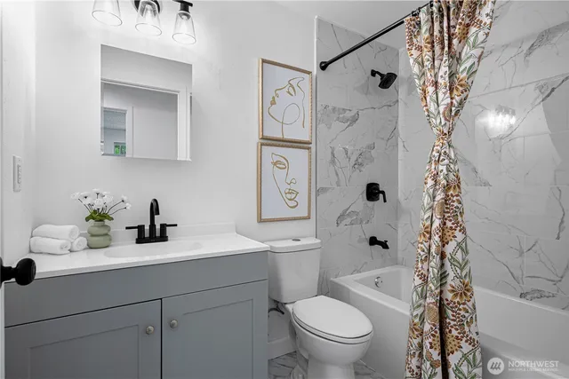 a bathroom with a sink a toilet and a mirror