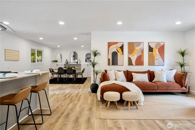 a living room with furniture lamp and rug
