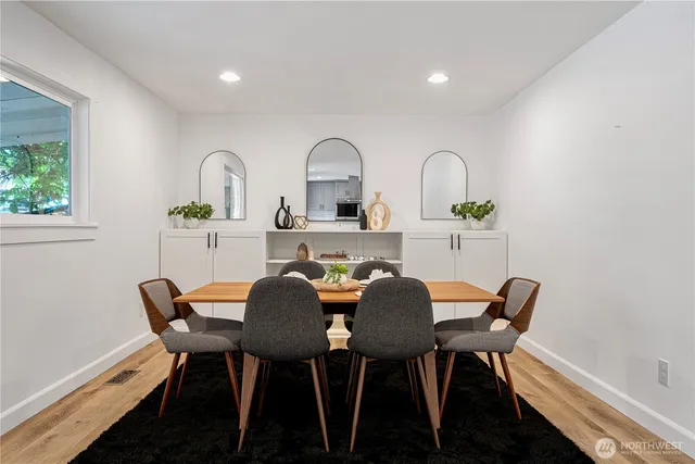 a view of a dining room with furniture and a window