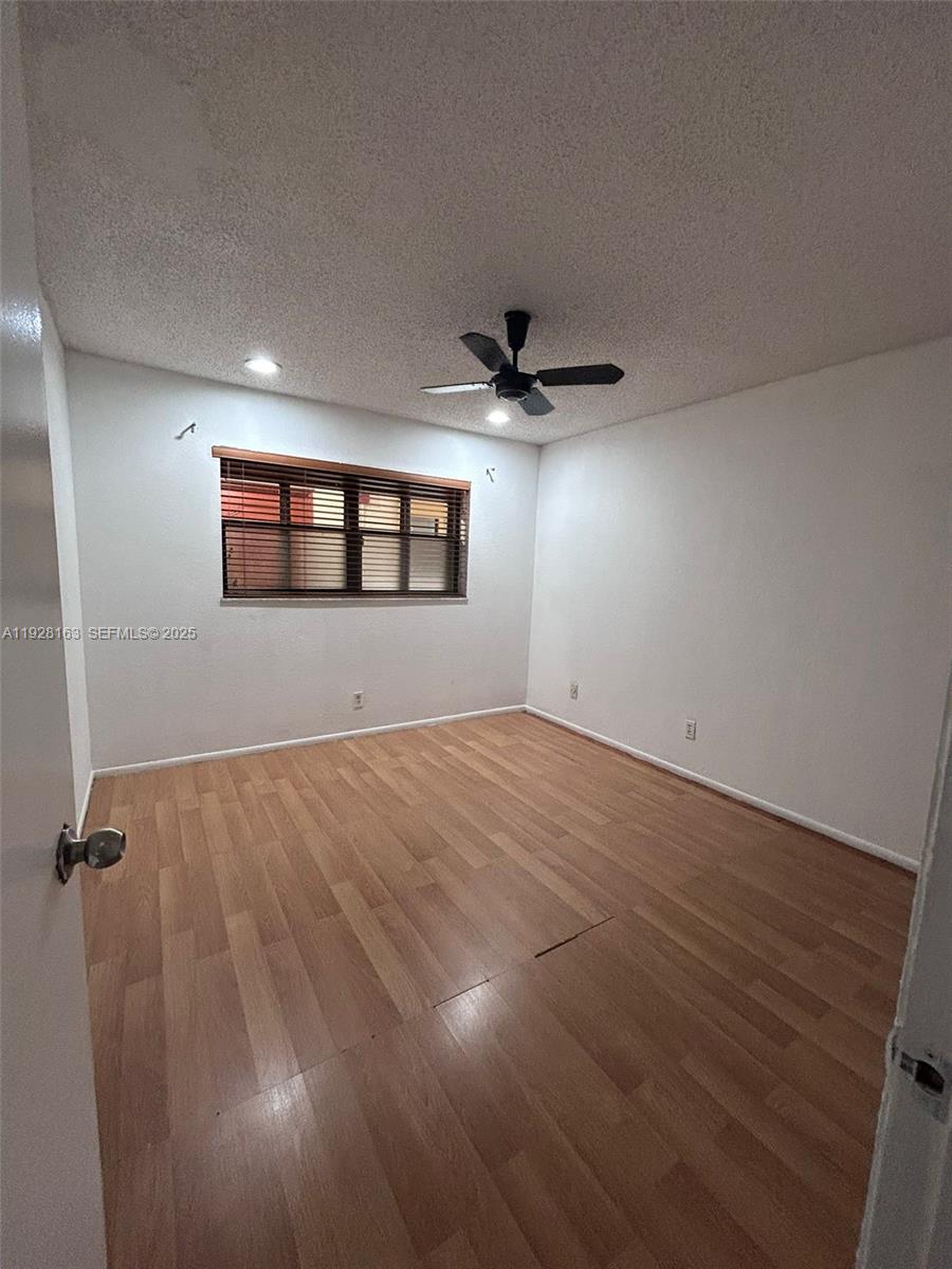 2997 Riverside Drive, Unit 212 Coral Springs, FL 33065 - Photo 12 of 18 a view of empty room with windows