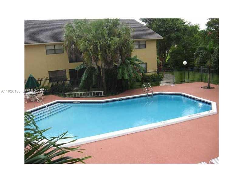 2997 Riverside Drive, Unit 212 Coral Springs, FL 33065 - Photo 3 of 18 a view of a swimming pool