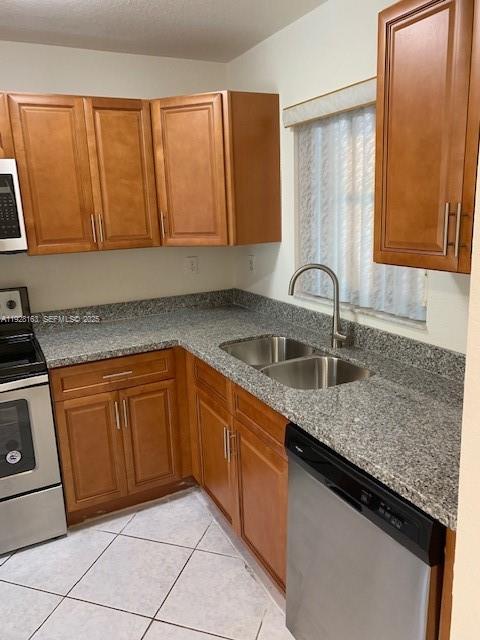 2997 Riverside Drive, Unit 212 Coral Springs, FL 33065 - Photo 9 of 18 a kitchen with granite countertop a sink and cabinets