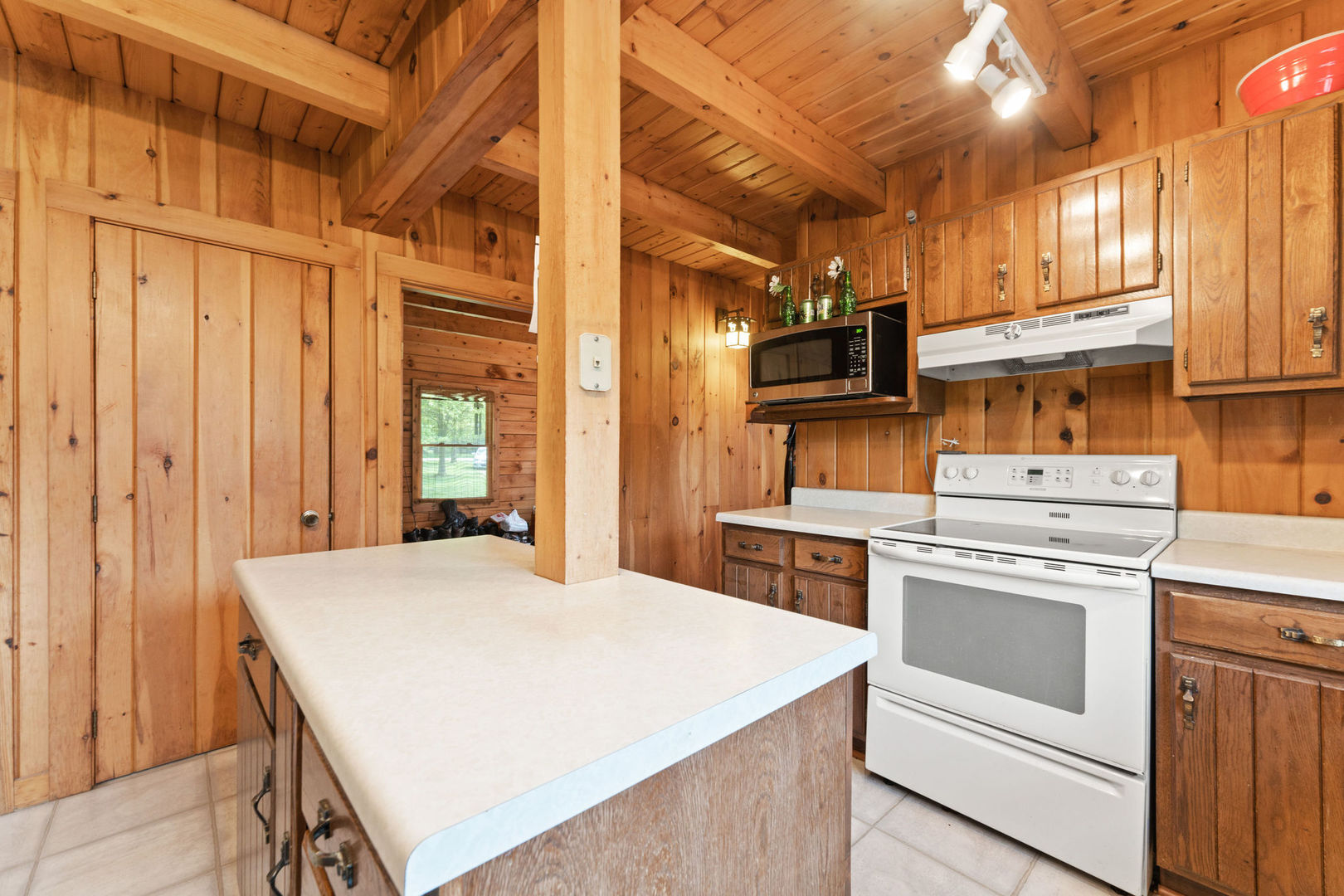 14265 Barber Greene Road Sycamore, IL 60178 - Photo 17 of 38 a kitchen with a stove and a refrigerator