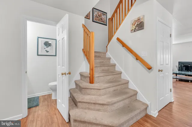 a kitchen with stainless steel appliances granite countertop a stove a refrigerator and a sink