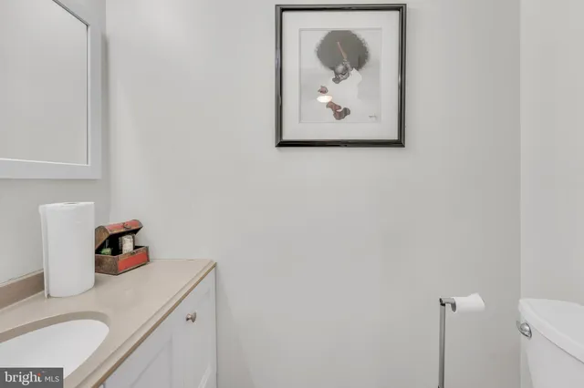 a kitchen with granite countertop white cabinets stainless steel appliances and sink