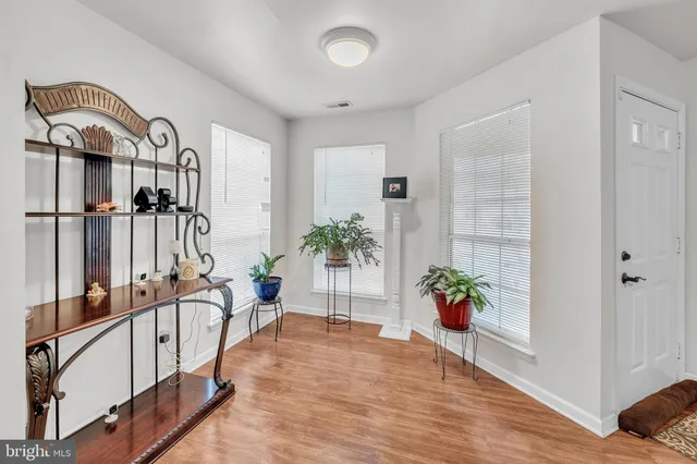 a bathroom with a toilet and a shower curtain