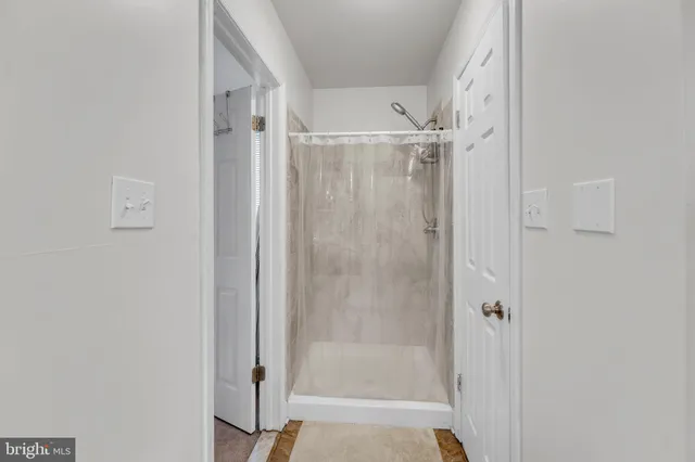 a white toilet sitting next to a bathroom sink