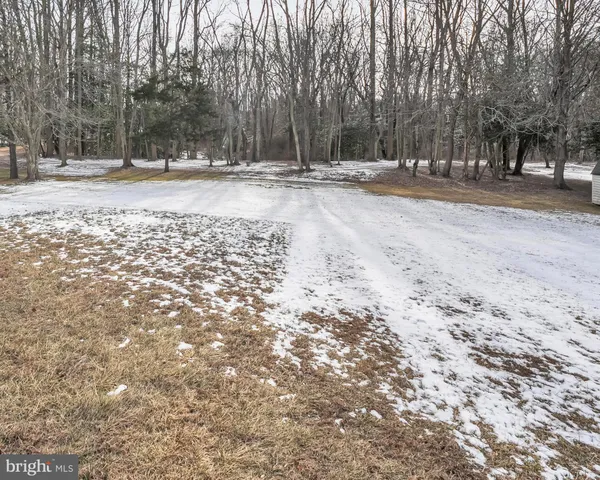 a view of a house with basketball court