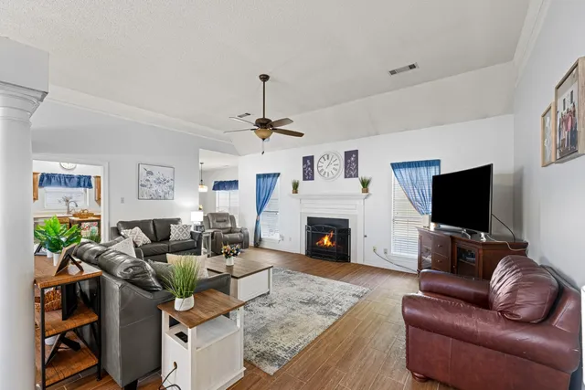 a living room with furniture and a flat screen tv