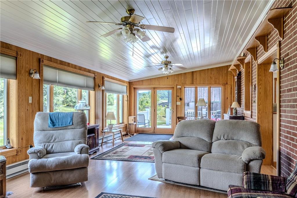440 Owl Hollow Road Ligonier, PA 15658 - Photo 20 of 49 a living room with furniture and a large window