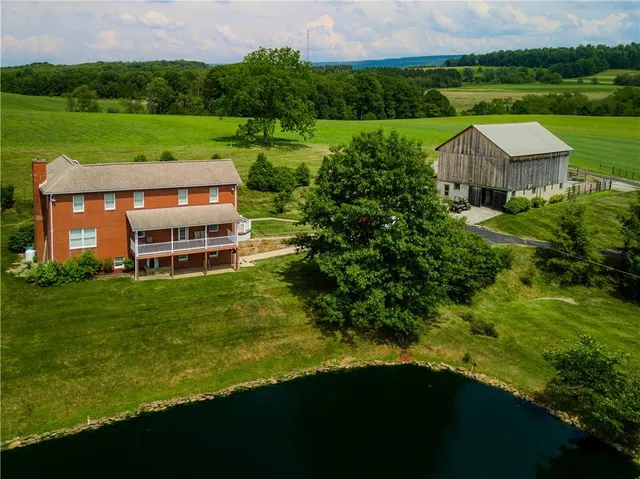 a aerial view of a house with a garden and plants