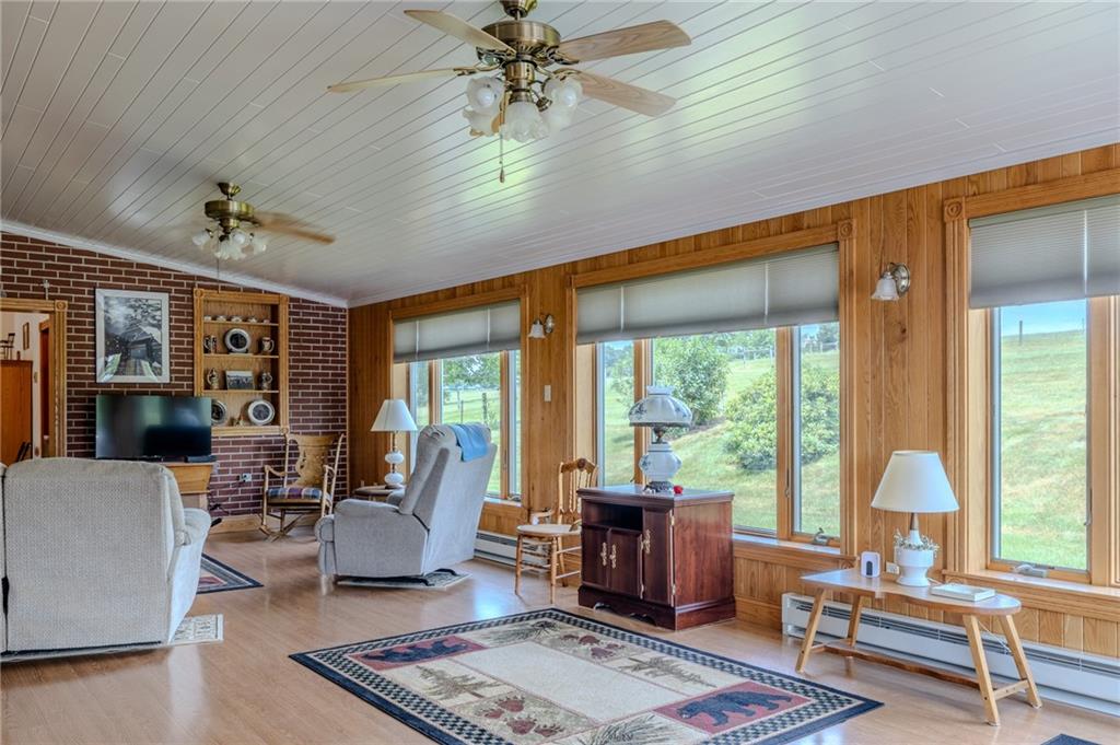 440 Owl Hollow Road Ligonier, PA 15658 - Photo 22 of 49 a living room with furniture and a large window