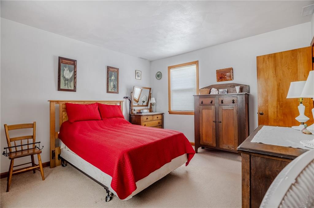 440 Owl Hollow Road Ligonier, PA 15658 - Photo 26 of 49 a bedroom with a bed and a tv