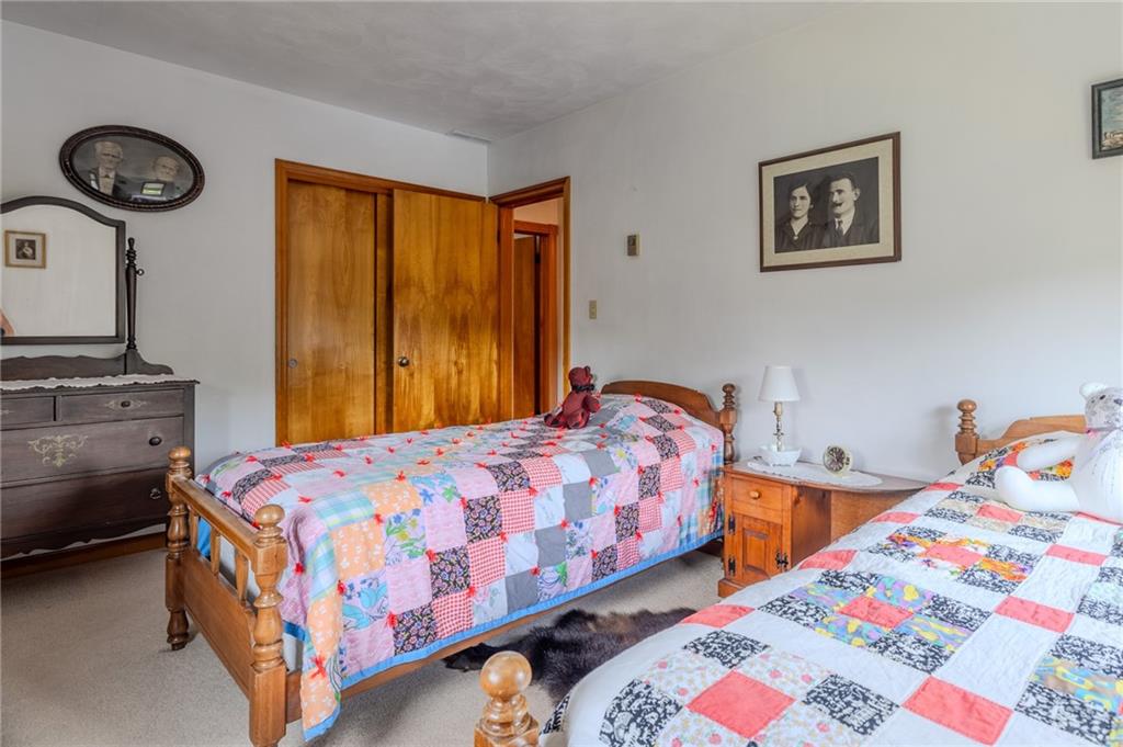 440 Owl Hollow Road Ligonier, PA 15658 - Photo 27 of 49 a bedroom with bed and two windows