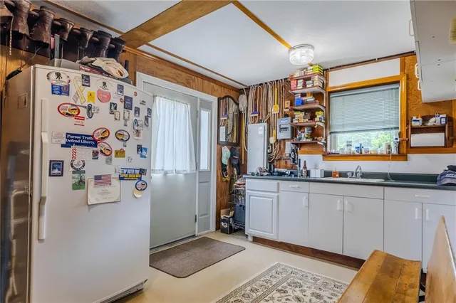 a living room with furniture window and a flat screen tv