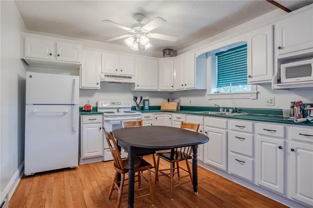 a living room with furniture flat screen tv and a fireplace