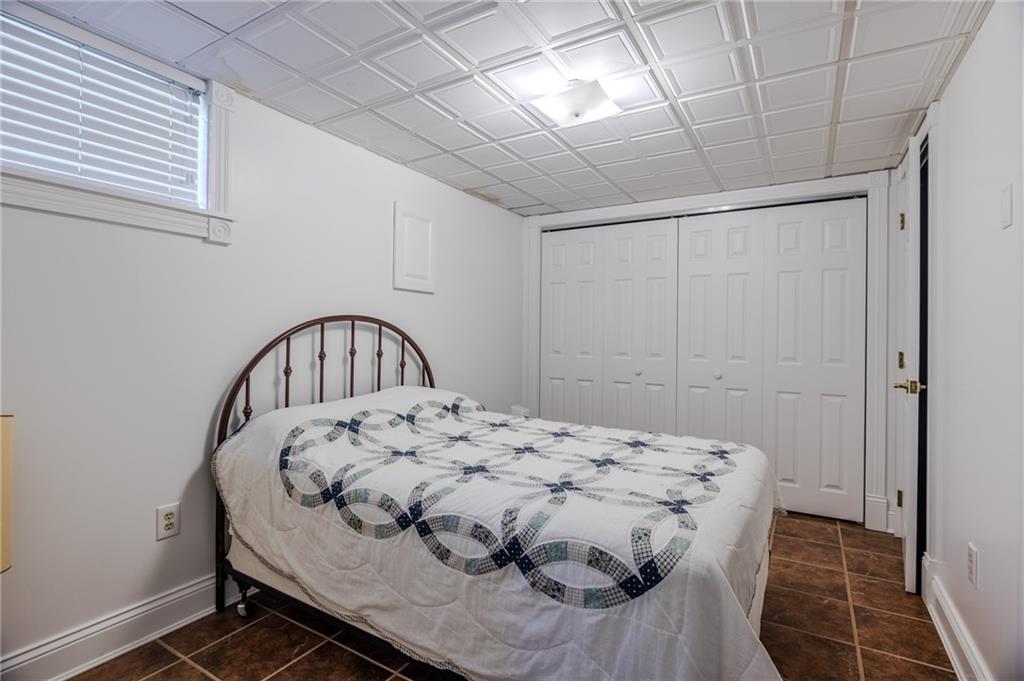 440 Owl Hollow Road Ligonier, PA 15658 - Photo 33 of 49 a bedroom with a bed and a dresser