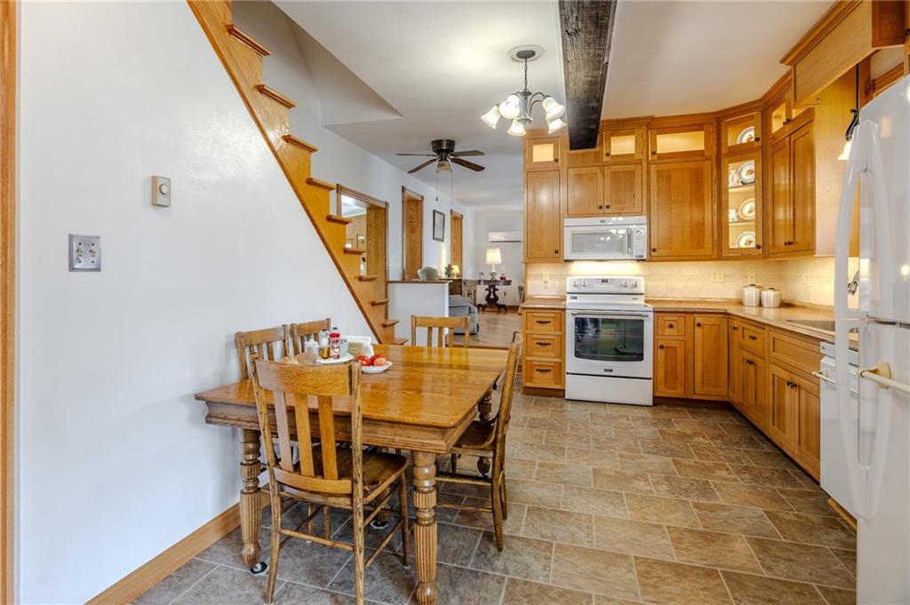 440 Owl Hollow Road Ligonier, PA 15658 - Photo 10 of 49 a view of a kitchen with furniture and a wooden floor