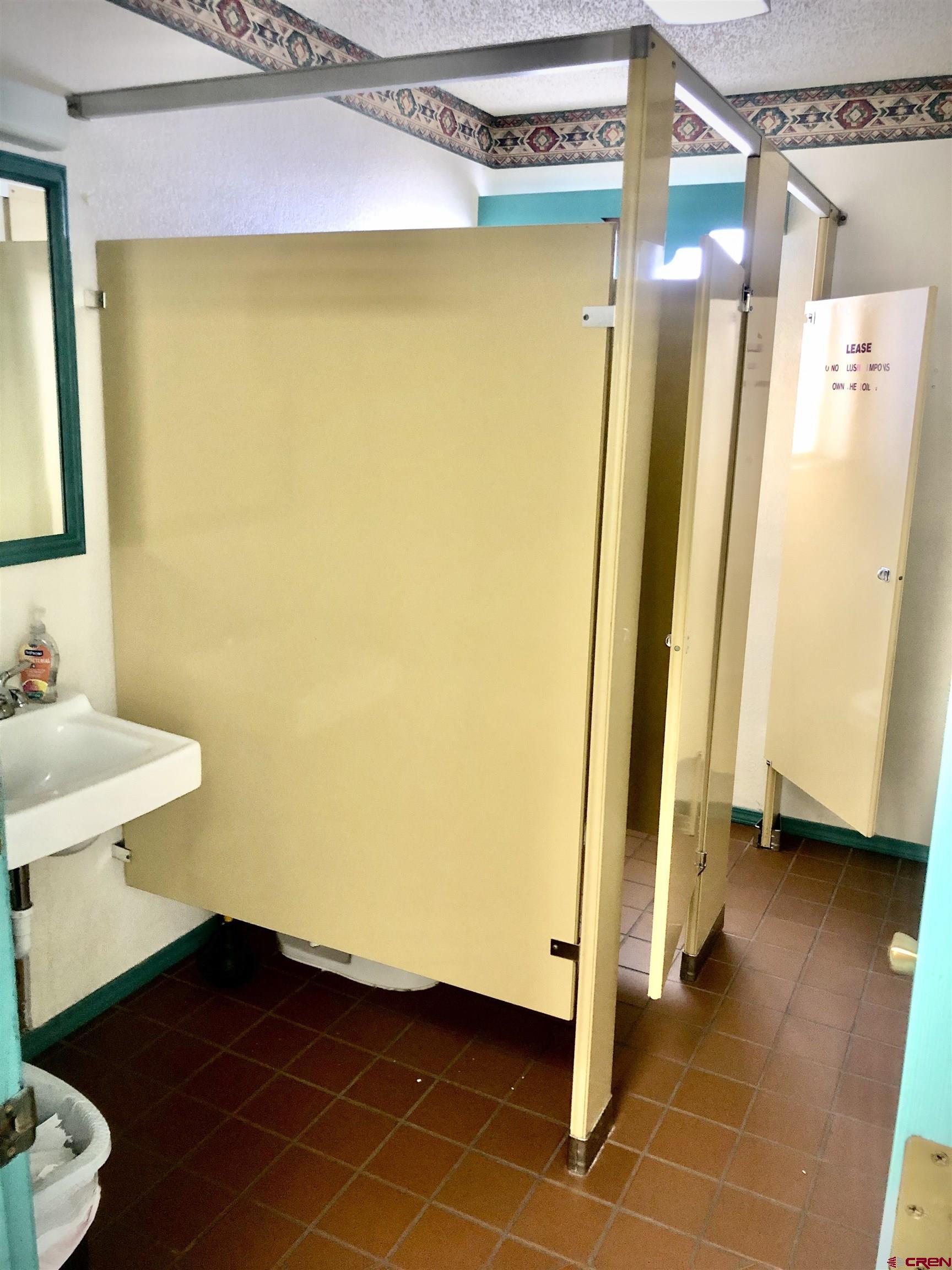 721 Main Street Delta, CO 81416 - Photo 14 of 17 a bathroom with a sink and a mirror
