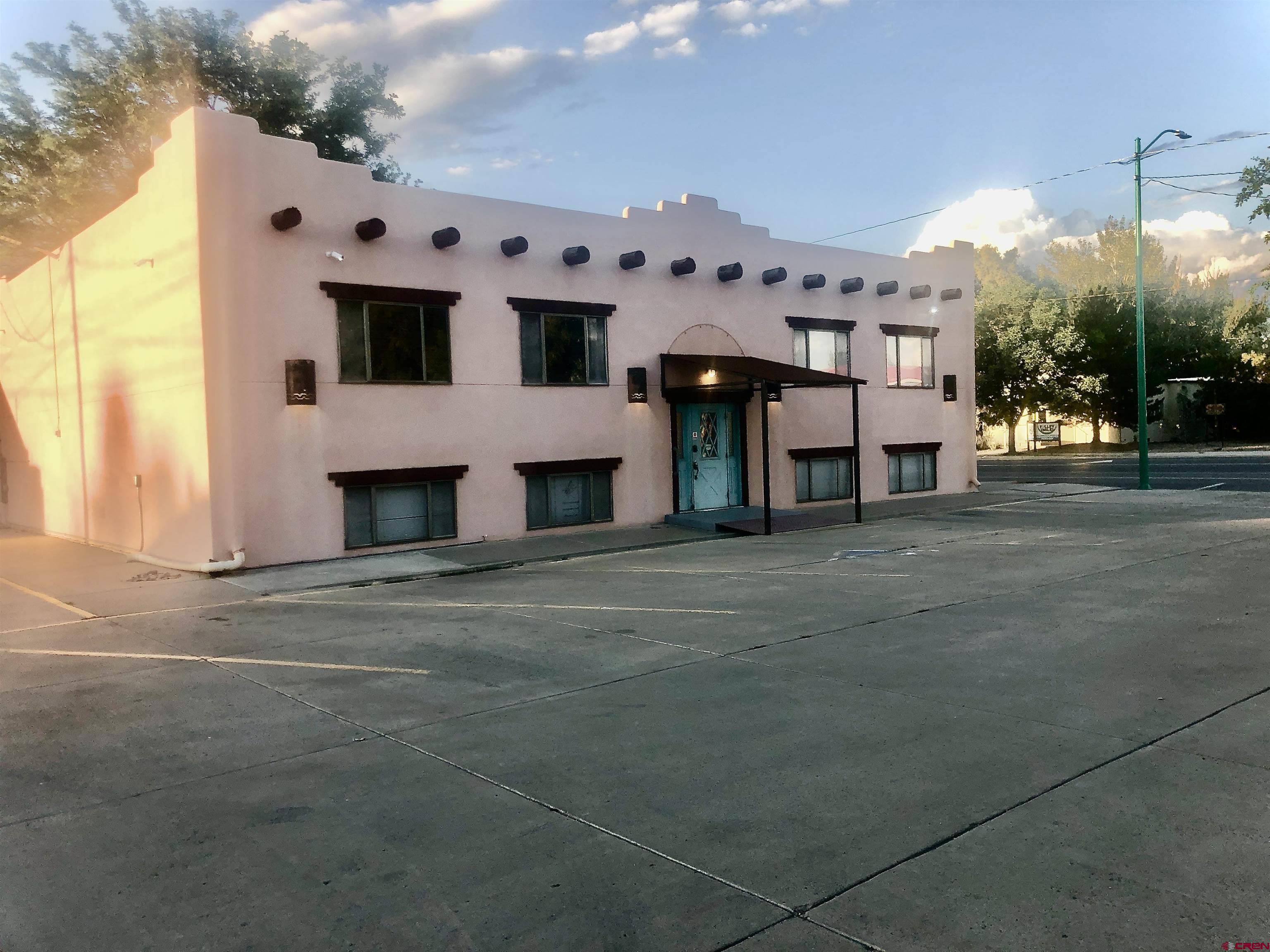 721 Main Street Delta, CO 81416 - Photo 3 of 17 a view of white house with a garage