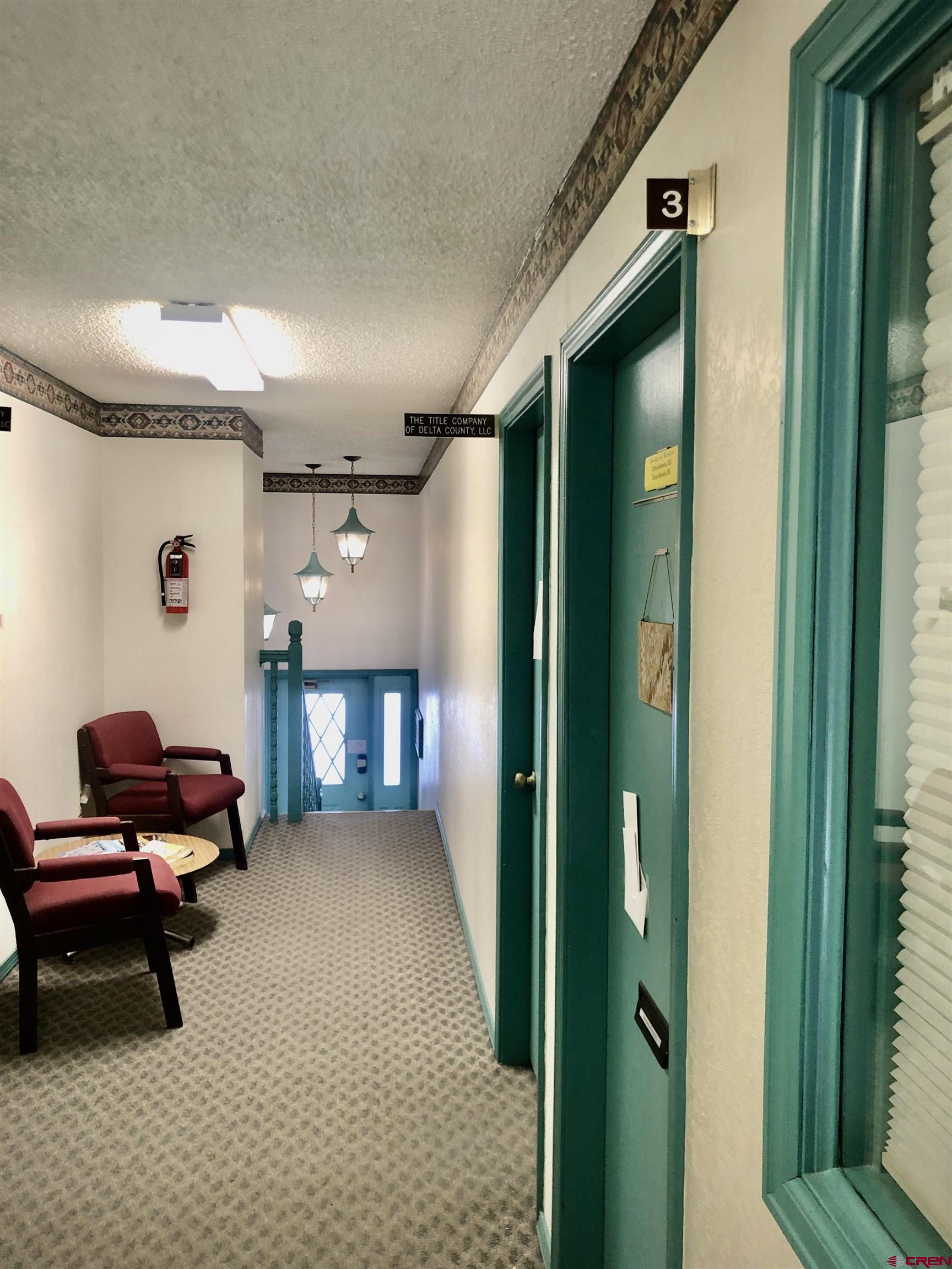 721 Main Street Delta, CO 81416 - Photo 8 of 17 a living room with furniture and a fireplace