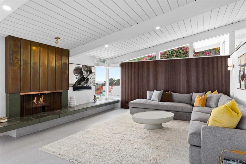 5972 Avenida Chamnez La Jolla, CA 92037 - Photo 9 of 9 a living room with furniture and a rug