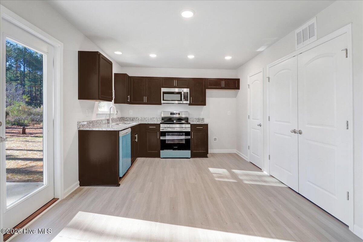 11379 Red Bud Road Castalia, NC 27816 - Photo 26 of 29 Stainless Steel appliances - the blue is the protective film