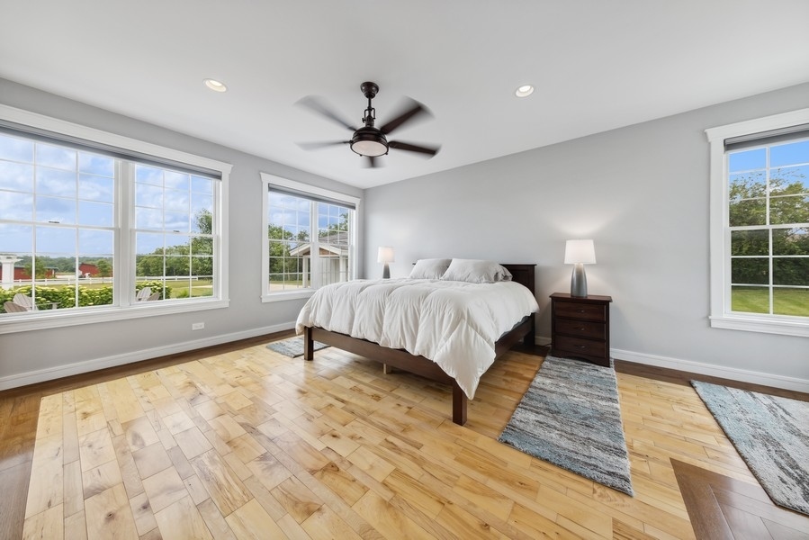 12243 179th Street Mokena, IL 60448 - Photo 56 of 101 a spacious bedroom with a large bed and a window